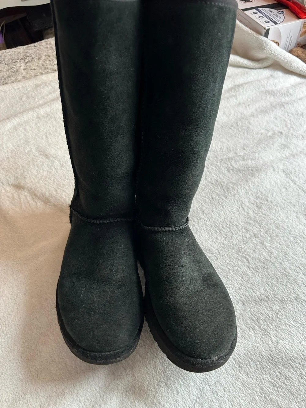 Tall black UGG boots